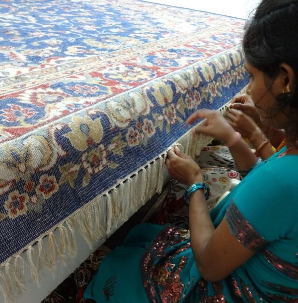 Clipping and inspecting the finished rug